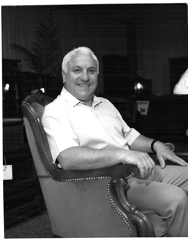 Frank Pierotti seated in an armchair in the Caesars showroom